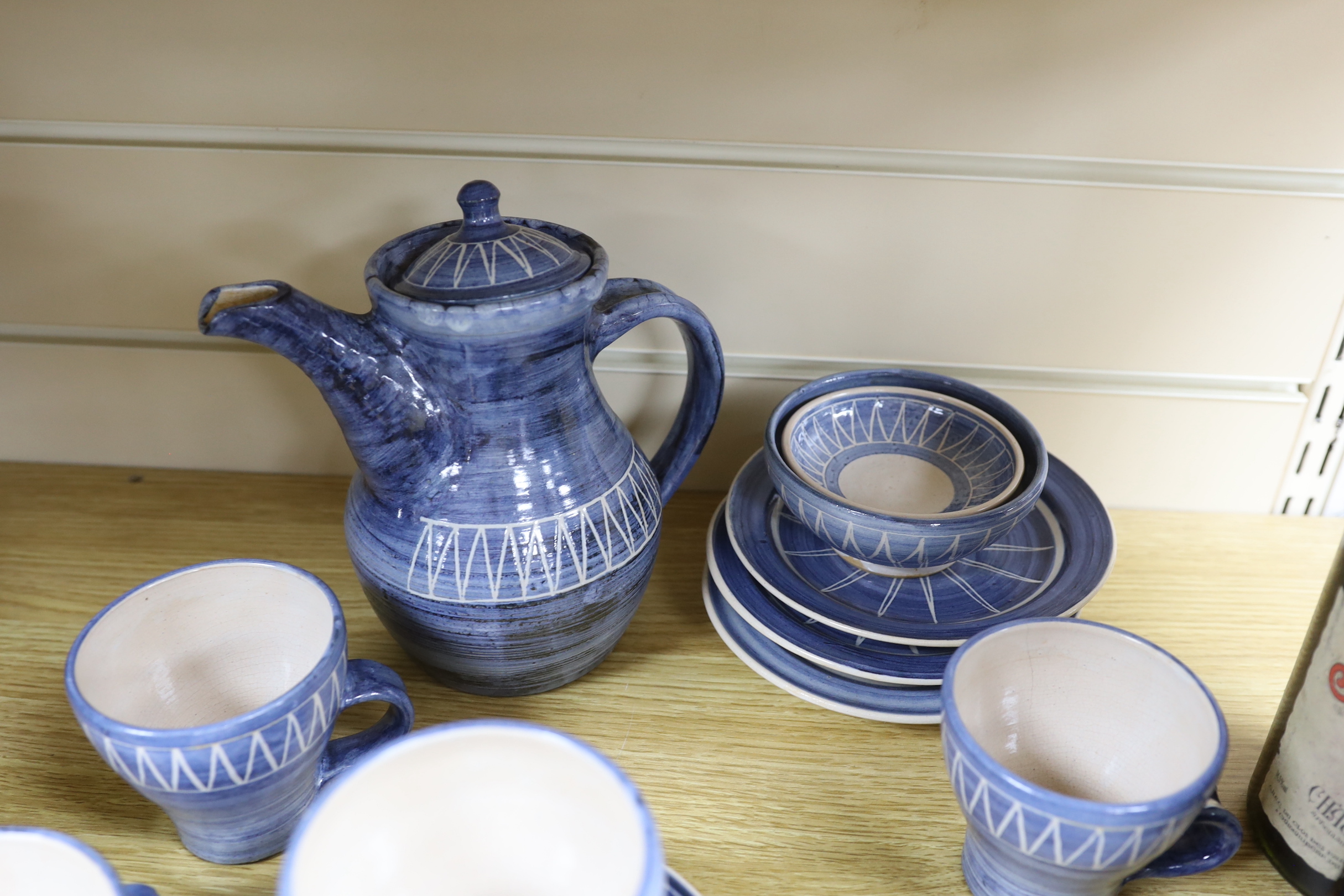 A tin glazed pottery coffee set, base signed W.